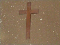 Simple wooden cross placed in grave
