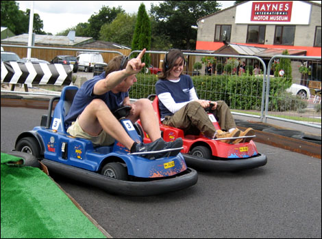 Jo Phillips and Andrew Enever racing in go carts