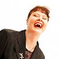 Image of a woman laughing out loud