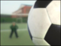 Ball heading towards goal.