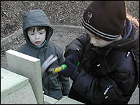 A Junior Ranger watched by a Junior Health and Safety Supervisor!