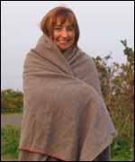 Sam Smith wrapped in a blanket