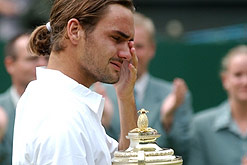 Image: Roger Federer wipes away a tear after his victory at the Wimbledon finals in 2003
