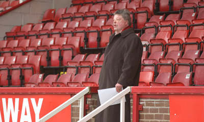 Simon practises singing from the terraces