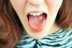 A young woman poking out her tongue