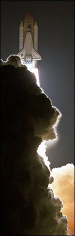 The Space Shuttle Discovery takes off.