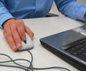 Man using computer mouse and keyboard
