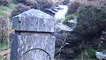 At the end of the track you'll come to a rocky outcrop in the hillside with steps carved into it.