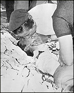A nurse gives mouth to mouth respiration to Tommy. (Photo by Central Press/Getty Images) 
