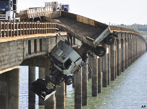 A truck hangs from the Chavantes bridge near Fartuna, Brazil. 