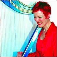 Corrina playing the harp
