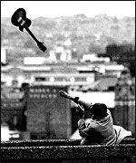 Man throws a guitar