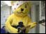 Pudsey plays guitar
