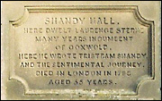 The plaque over the door at Shandy Hall