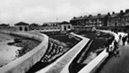 Black and white view of gardens and 1930s swimming pool building at Troon Esplanade.