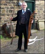 Man with scythes