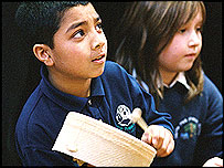 school children playing musical instruments