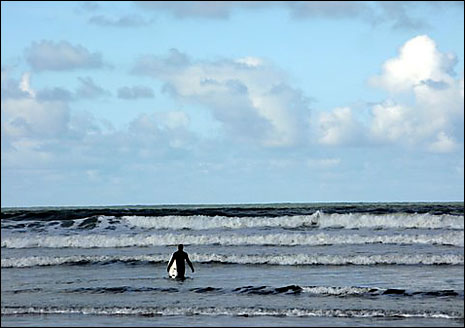 A surfer at Saunton Sands