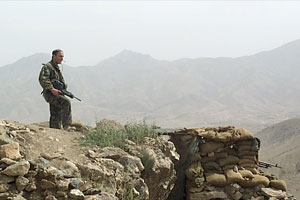 Soliders keep watch over the city from the Kabul Gates observation post