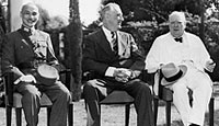 China's Generalissimo Chiang Kai-Shek; US President Franklin Roosevelt and British Prime Minister Winston Churchill, seated together on the lawn during the historic Cairo conference