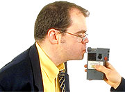 man taking a breathalyser test