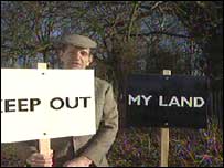 Nick Lawrence with "Keep Out" sign