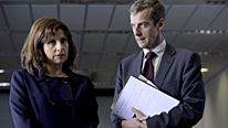 Malcolm (Peter Capaldi) with Nicola (Rebecca Front), the new Secretary of State, are in The Thick Of It