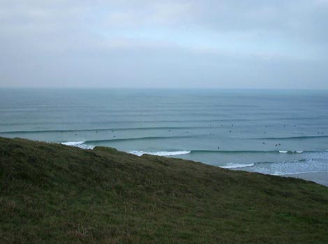 Surfers catching waves