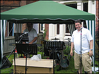 Musicians under temporary gazebo