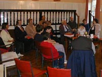 Quakers sitting in silence at a meeting for worship