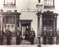 Photograph showing some of the Birmingham police force outside their station