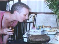 Hilary blowing out the candles on her birthday cake