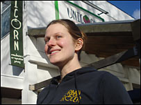 Woman outside Unicorn organic grocery