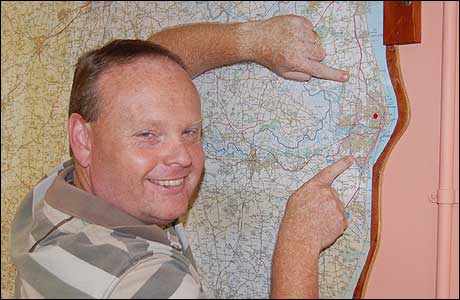 Mark Murphy with the BBC Suffolk newsroom wallmap.
