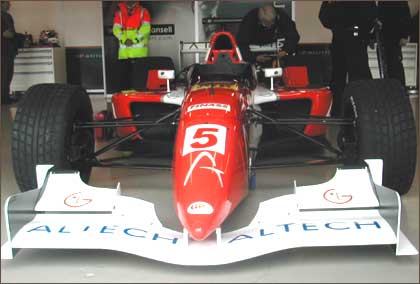 Nigel Mansell in his Grand Prix Masters racecar