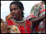Kenyan woman with tambourine