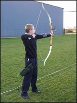Boy with archery bow and arrow