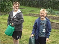 Sam and Tim with watering cans