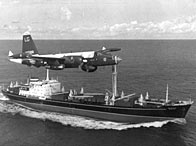A P2V Neptune US patrol plane flying over a Soviet freighter during the Cuban missile crisis, 1962