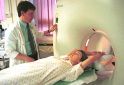 A patient moves into an MRI scanner