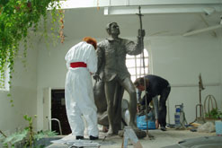 Angela Conner working on her statue of Laurence Olivier in her studio in Holland Park