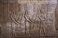 Ptolemy VIII, Euergetes II, and his wives Cleopatra II and III, as shown in the temple at Kom Ombo