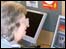People using the computers on the BBC Cumbria bus