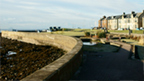 Colour view of pedestrian area of paving and grass at Troon Esplanade.