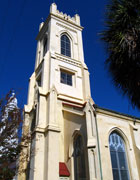 Pale stone tower of a Unitarian Universalist church
