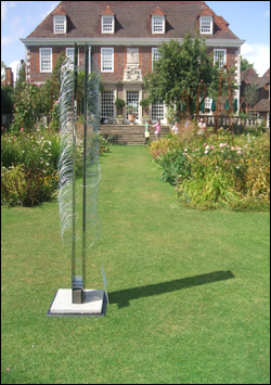Modern sculputre contrasted nicely with traditional gardening