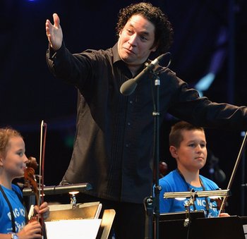 Conductor Gustavo Dudamel with children from Raploch at The Big Concert