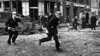 Air raid wardens race to the rescue in Farringdon, London, after a V2 rocket explosion in March 1945. 
