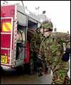 Soldiers on fire engines