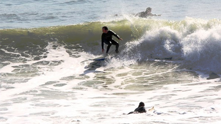 A surfer paddling